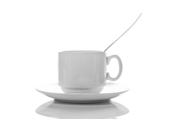 empty small white porcelain coffee Cup with a spoon on a white saucer side view isolated on a white background