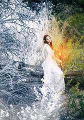 
a girl with elven ears in a white dress walks through the woods and holds in her hands a magic staff, glowing