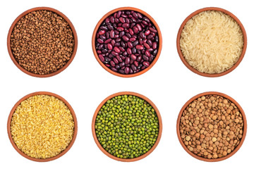 Collection of various grains and legumes in bowls isolated on white background Set of cereals. Top view.
