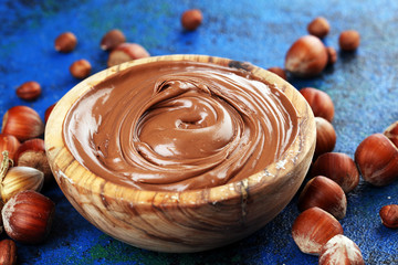 Homemade hazelnut spread in wooden bowl. Hazelnut Nougat cream with hazelnuts