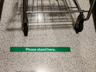 Social distancing signs in the grocery store