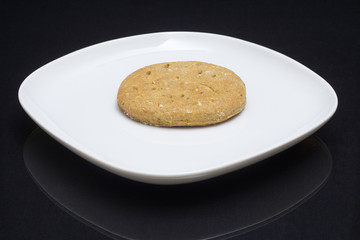 Rye cake on a white plate.