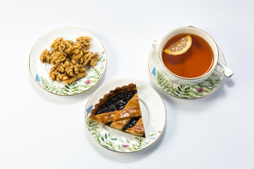 Drinking tea with nut pie