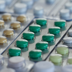 blisters with green, yellow and white tablets