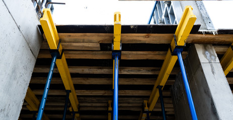 Construction, fittings, excavator, workers in suits, fastening fittings, hydraulic press couplings.