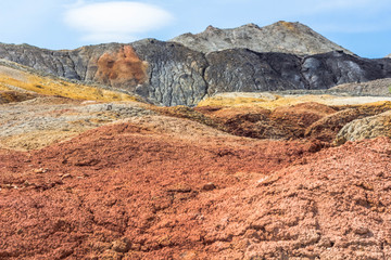 Apocalyptic landscape like a planet Mars surface. Solidified red-brown black Earth surface. Barren, cracked and scorched land. Global warming concept. Refractory clay quarries.