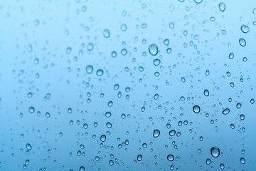 Fototapeta na wymiar Water rain drops on glass window background. , Clear vapor water bubbles on window glass surface for your design.