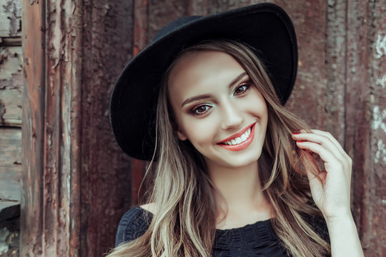 Beautiful happy woman natural face freckles casual female  portrait lifestyle beauty girl in black hat
