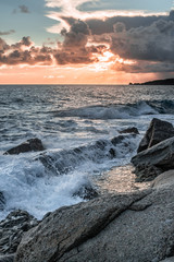 sunset clouds and waves on the island of elba