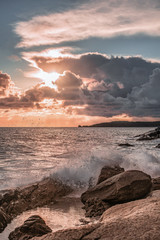 sunset clouds and waves on the island of elba