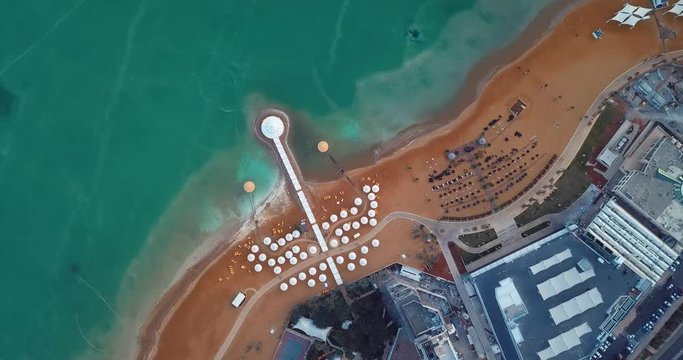 Ein Bokek, Israel - January 04, 2020: 4k Aerial View to the Luxury Hotel and Dead Sea Beach 