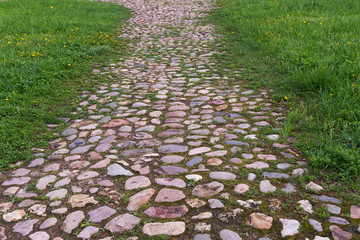 Park path paved with colorful rounded stones