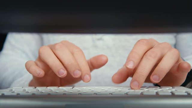 Clean shot of male hands type text on desktop keyboard. Freelancer or sick office worker work from home. Write emails, type code or write reviews on internet. Stay busy and efficient when work at home