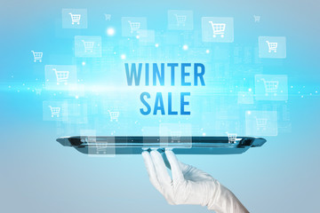 Waiter serving WINTER SALE inscription, online shopping concept