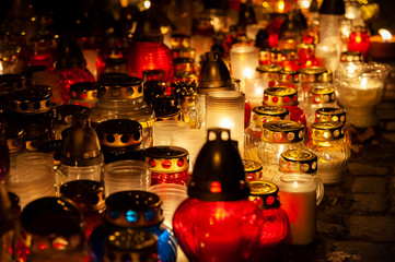 Candles burning at a cemetery. Polish tradition of commemorating deceased loved ones. 'All Saints Day' - November 1st