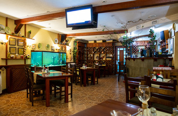 Fototapeta na wymiar Interior of cozy classic Italian restaurant