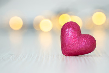 Obraz premium Pink glitter heart shaped bokeh background