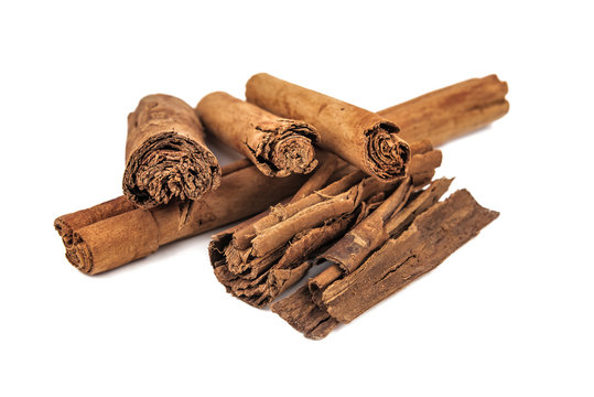 real original cinnamon sticks on white