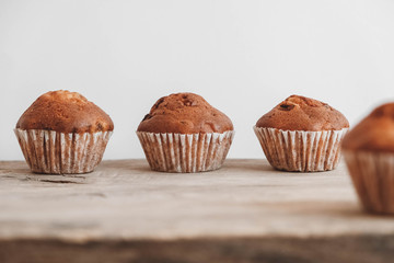 Chocolate cupcakes on wooden table background. Copy, empty space for text