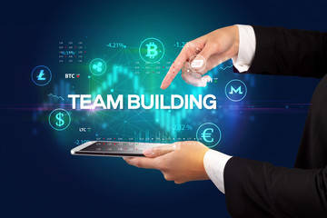Obraz premium Close-up of a touchscreen with TEAM BUILDING inscription, business opportunity concept