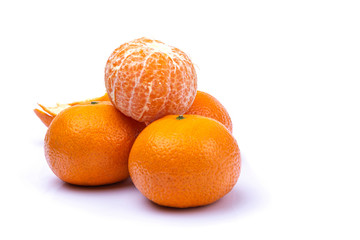 ripe tangerines on a white isolated background, close-up, a place for text