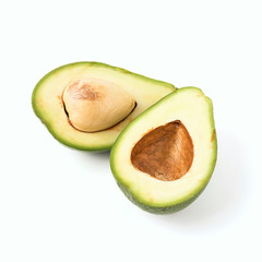 green avocado halves with a bone on a white background isolate