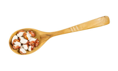 Soy beans on a wooden spoon isolated on a white background