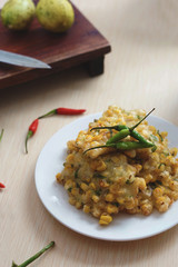 Bakwan Jagung Indonesia traditional snack food or fritter corn taste sweet serve with green chili
