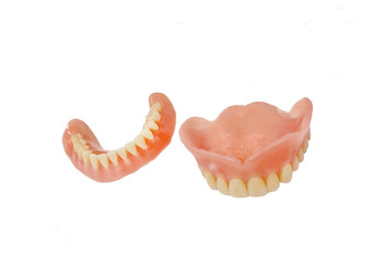 Complete full dentures isolated on white background