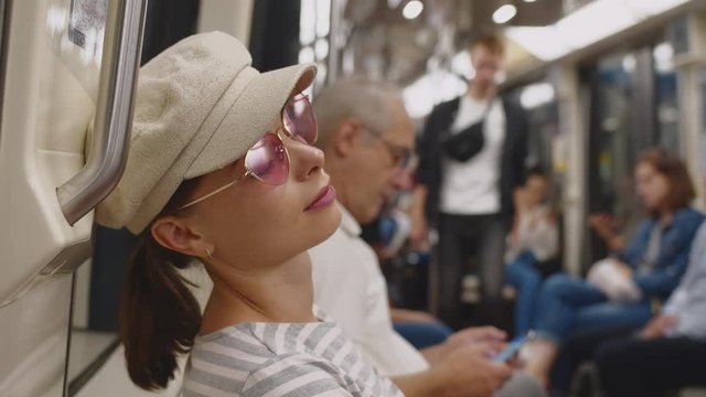 Sleeping woman in the subway in Paris, France