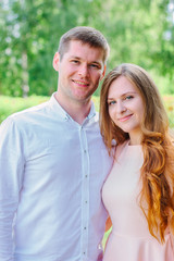 Fototapeta premium Young happy couple standing on the nature park