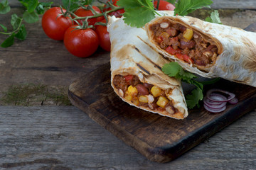burritos on a wooden background