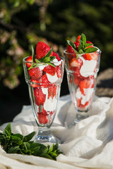 Fresh strawberries with yoghurt and whipped cream. Breakfast time. Healthy food. Delicious dessert sugar free. Vegetarian dish. Spring time 