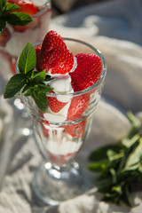 Fresh strawberries with yoghurt and whipped cream. Breakfast time. Healthy food. Delicious dessert sugar free. Vegetarian dish. Spring time 