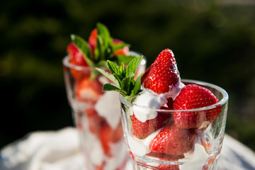 Fresh strawberries with yoghurt and whipped cream. Breakfast time. Healthy food. Delicious dessert sugar free. Vegetarian dish. Spring time 