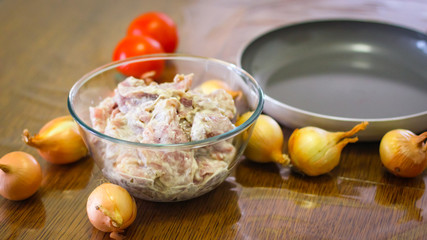 Cooking Meat. Onions And Tomatoes Dance Around The Frying Pan, Then A Plate Of Sliced Meat Appears In The Picture.