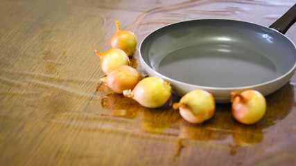 Cooking. Onions And Tomatoes Dance Around The Frying Pan.