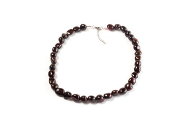 Natural pomegranate beads on a white background isolate