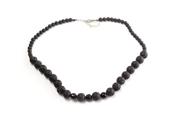 natural lava beads on a white background isolate