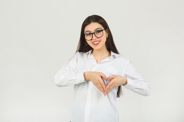 beautiful young woman in glasses on a white background	
