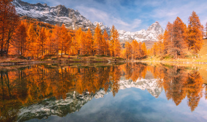 Matterhorn at sunset reflected in Blu lake, Cervinia, Aosta valley in Italy, Europe.