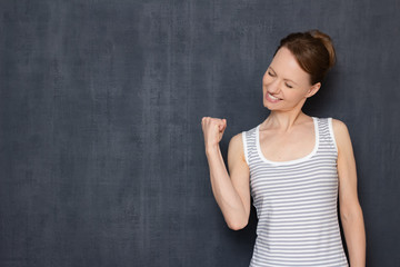 Portrait of happy overjoyed girl rejoicing at victory or success