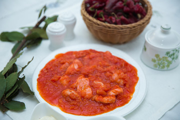 Tomato Pickle . Chicken and tomatoes . Red Dry Pepper in Traditional Basket . Tomato Pickle . Chakhokhbili - chicken stewed with tomatoes and onions. salt, pepper. Red Dry Pepper in Basket .