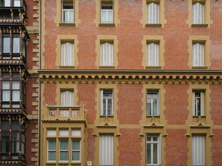 Fototapeta na wymiar Facade of the traditional spahish residential building. Domestic life concept. Basque country.
