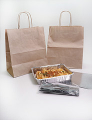 Healthy restaurant food in foil containers, food delivery.