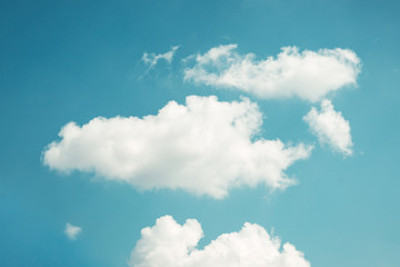 Naklejka na ściany i meble two large soft fluffy clouds on a blue sky.