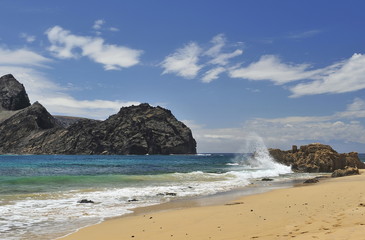 Fototapeta na wymiar Stone cliffs of volcanic origin in the Atlantic Ocean near Madeira Island