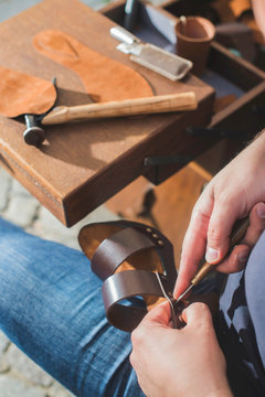 Close-up Of Shoemaker Making Sandal At Workshop