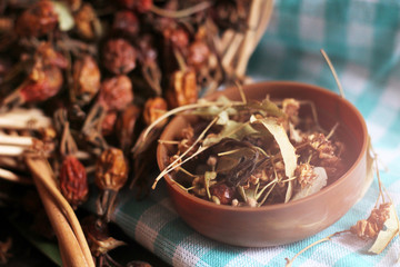 Dry medicinal grass in a wooden jar, macro