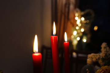Three candles for a romantic dinner in the evening